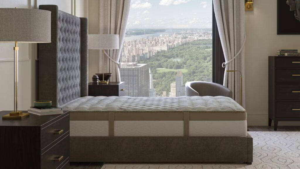 Luxury mattress in a modern bedroom with a city view and large windows overlooking Central Park.